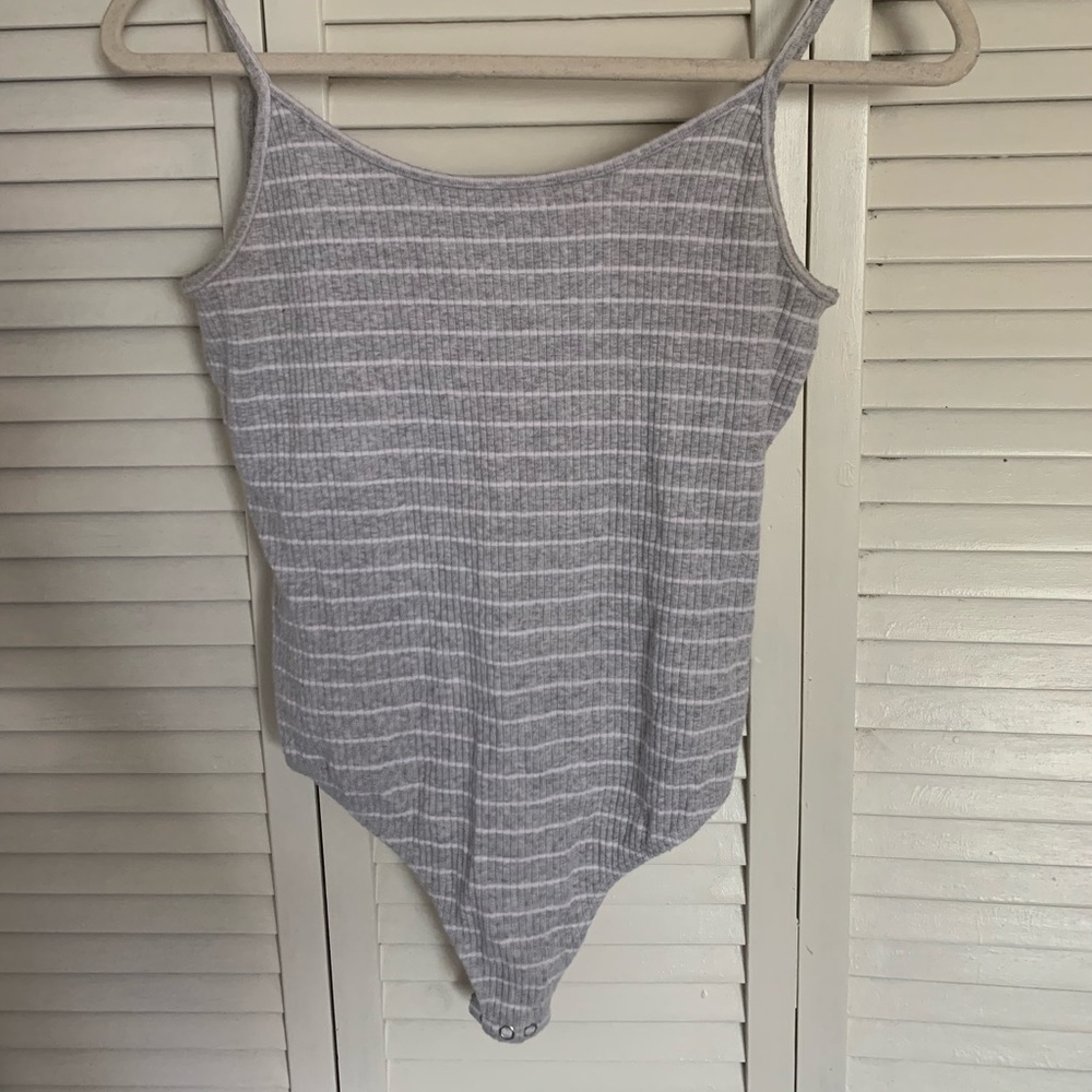 Grey and white body suit